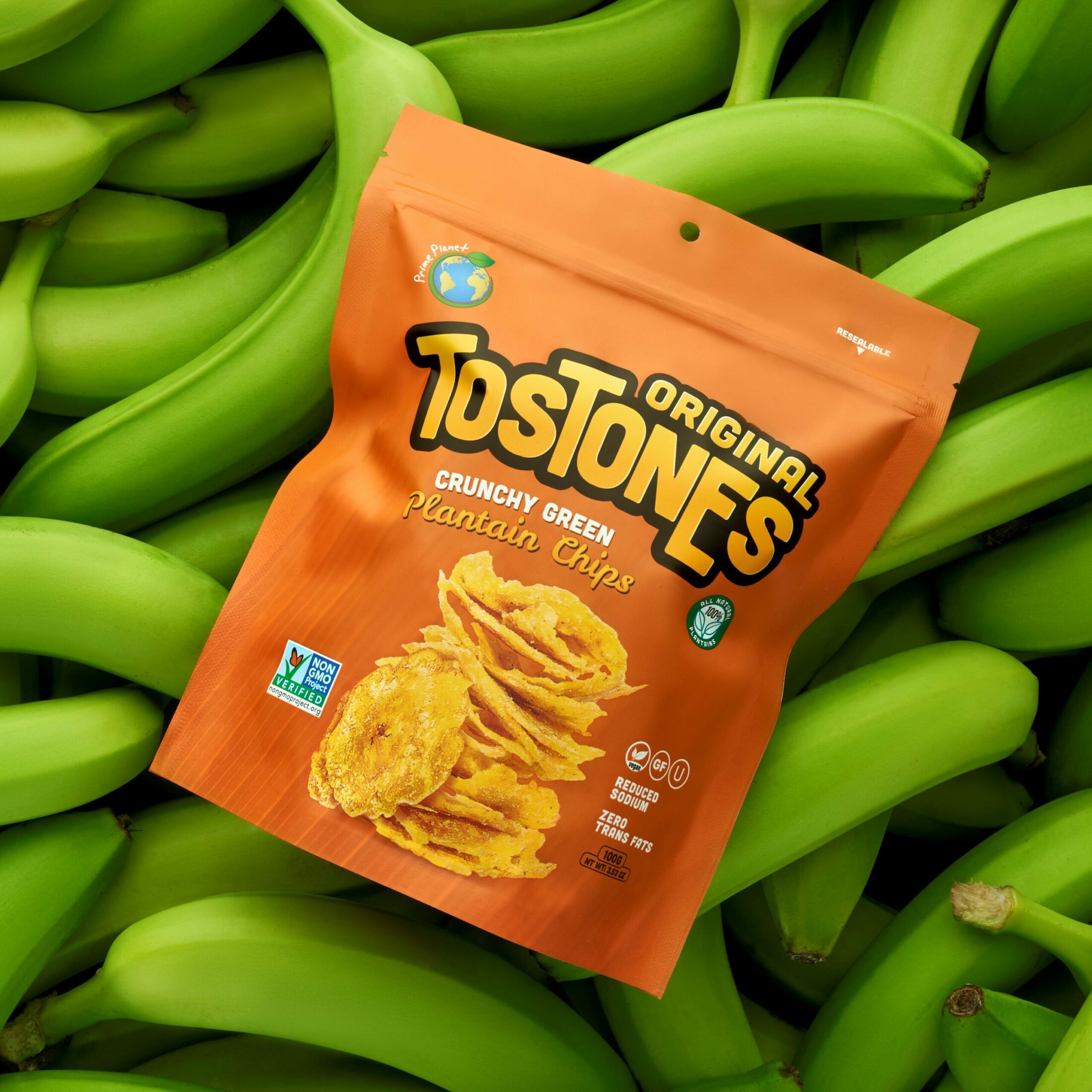 Original tostones bag on a bed of green bananas